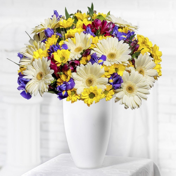 Irises - 13, Bacardi Yellow Spray Chrysanthemum - 7, Alstromeria lilac, purple - 7, Gerbera white - 11, Salal, Wrapping Paper, Ribbon