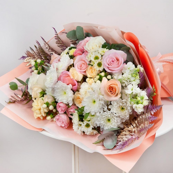 Baltica White Spray Chrysanthemum - 3, Santini White Spray Chrysanthemum - 3, Spray rose: white, cream, light pink 50 cm - 3, Carnation white, cream - 4, Peony sprayrose - 3, White Matthiola - 2, Pink rose 50 cm - 5, White rose 50 cm - 4, Rose Cream 50 cm - 4, Hypericum, Eucalyptus Cinerea, Pistachio, Fern (1 pc.), Wrapping Paper