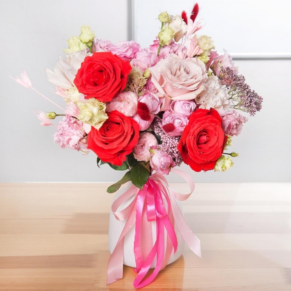 Red rose Nina 50 cm - 4, Pink rose 50 cm - 5, Rose Powder 50 cm Ecuador (Quicksand, Menta) - 3, Carnation white, cream - 5, Bright pink spray rose mix, 50 cm - 1, Peony sprayrose - 2, Pink Lisianthus (Eustoma) - 2, Ozotamnus, Dried flowers in assortment, Ribbon
