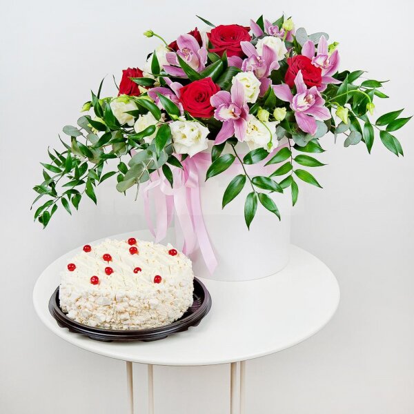 Red rose 50 cm - 7, Pink Cymbidium Orchid Bud - 7, lisianthus - 4, Round flower box medium, Film, Oasis, Eucalyptus Cinerea, Flask for orchids, Aspidistra (1 pc.), Cake in assortment, Ruscus italian, Ribbon