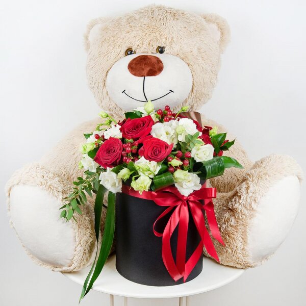 Red rose 50 cm - 9, lisianthus - 5, Round flower box medium, Oasis, Film, Ruscus, Aspidistra (1 pc.), Hypericum, Eucalyptus parvifolia (1 pc.), Teddy bear 70 cm, Ribbon