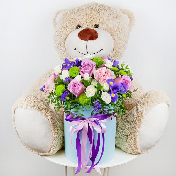 Deep Purple rose - 5, Spray rose: white, cream, light pink 50 cm - 7, Pink carnation - 3, Irises - 3, Athos pom Feeling Green - 2, Round flower box medium, Oasis, Film, Pistachio, Blue Statice, Teddy bear 70 cm, Ribbon